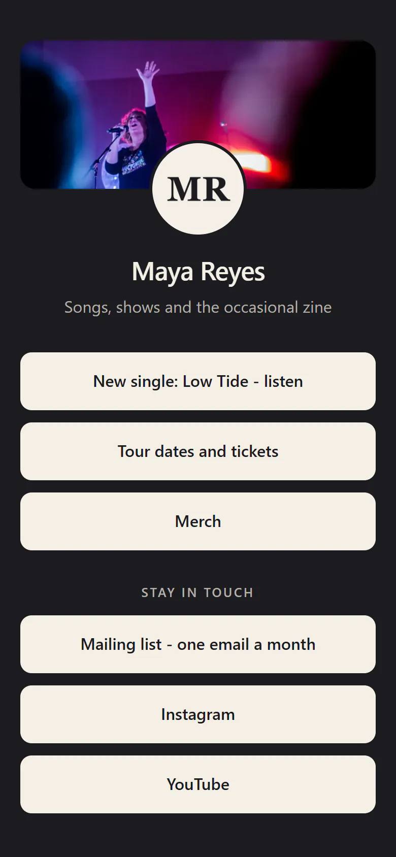A musician’s link in bio on a phone, dark with cream buttons: a cover photo of her on stage, the round MR logo, Maya Reyes - songs, shows and the occasional zine - then the new single, tour dates, merch, a mailing list, Instagram and YouTube.