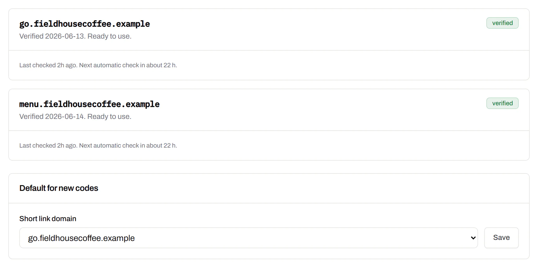 Two verified custom domains, go.fieldhousecoffee.example and menu.fieldhousecoffee.example, each with when it was last checked and a button to check it again, and under them the default for new codes set to go.fieldhousecoffee.example.